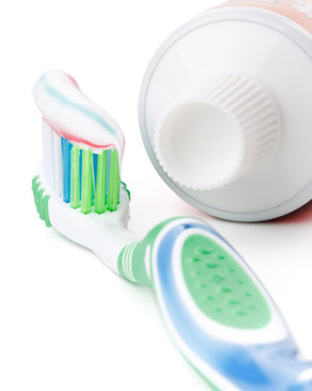photo of a toothbrush and toothpaste